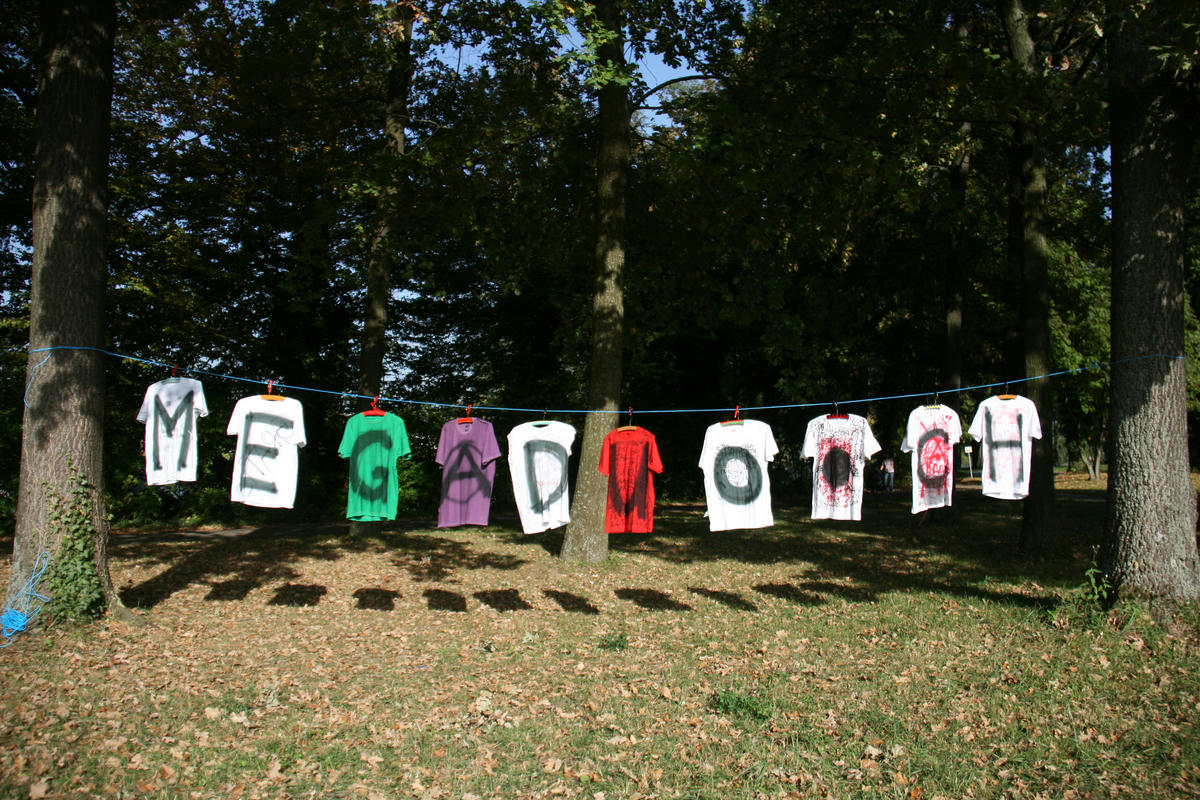 T-Shirts on a washing line forming the URL megaduo.ch.
