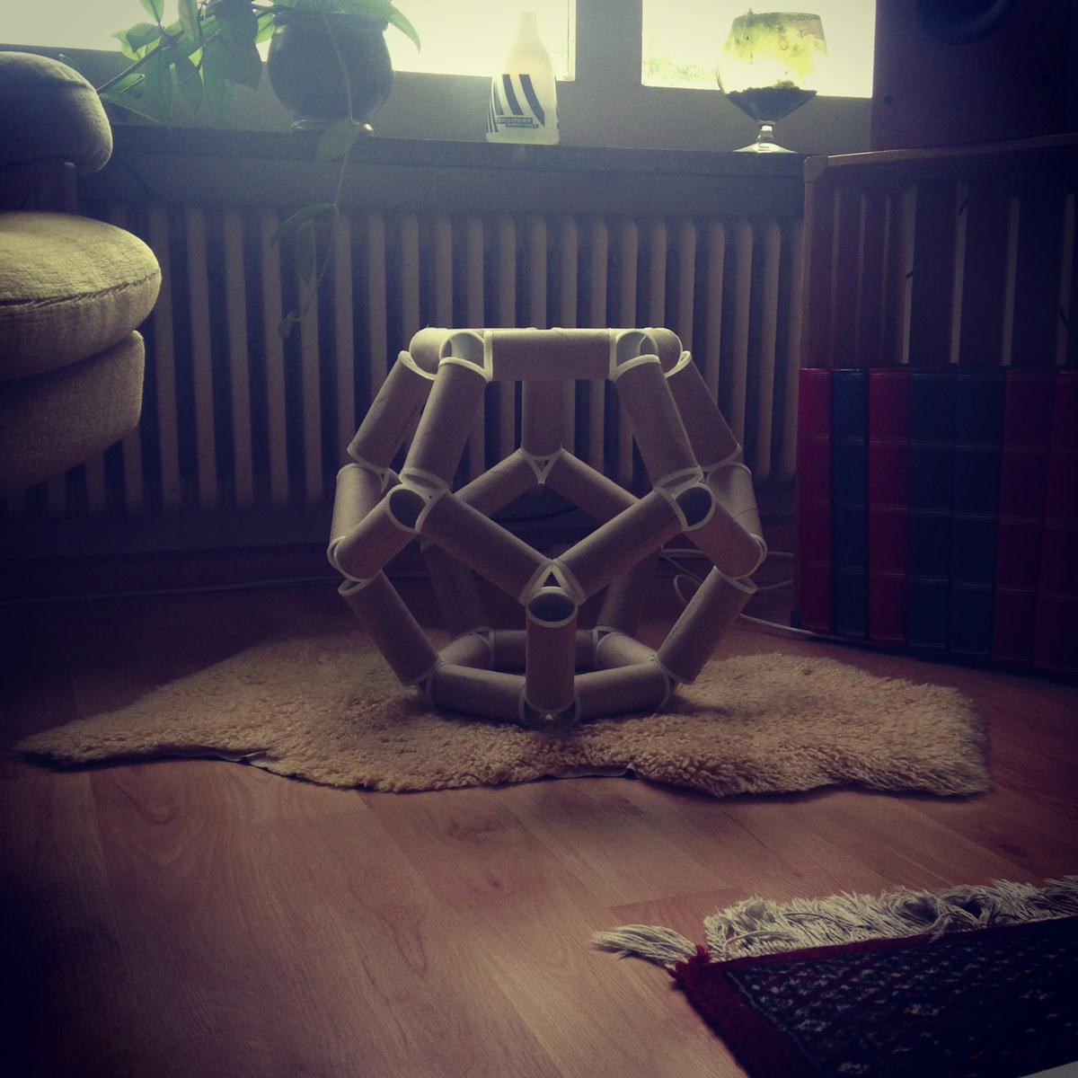 A dodecahedron made from toilet paper rolls