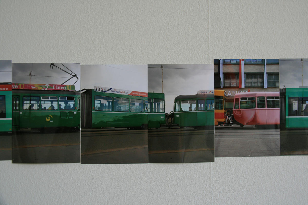 A tram on a wall made from small pictures